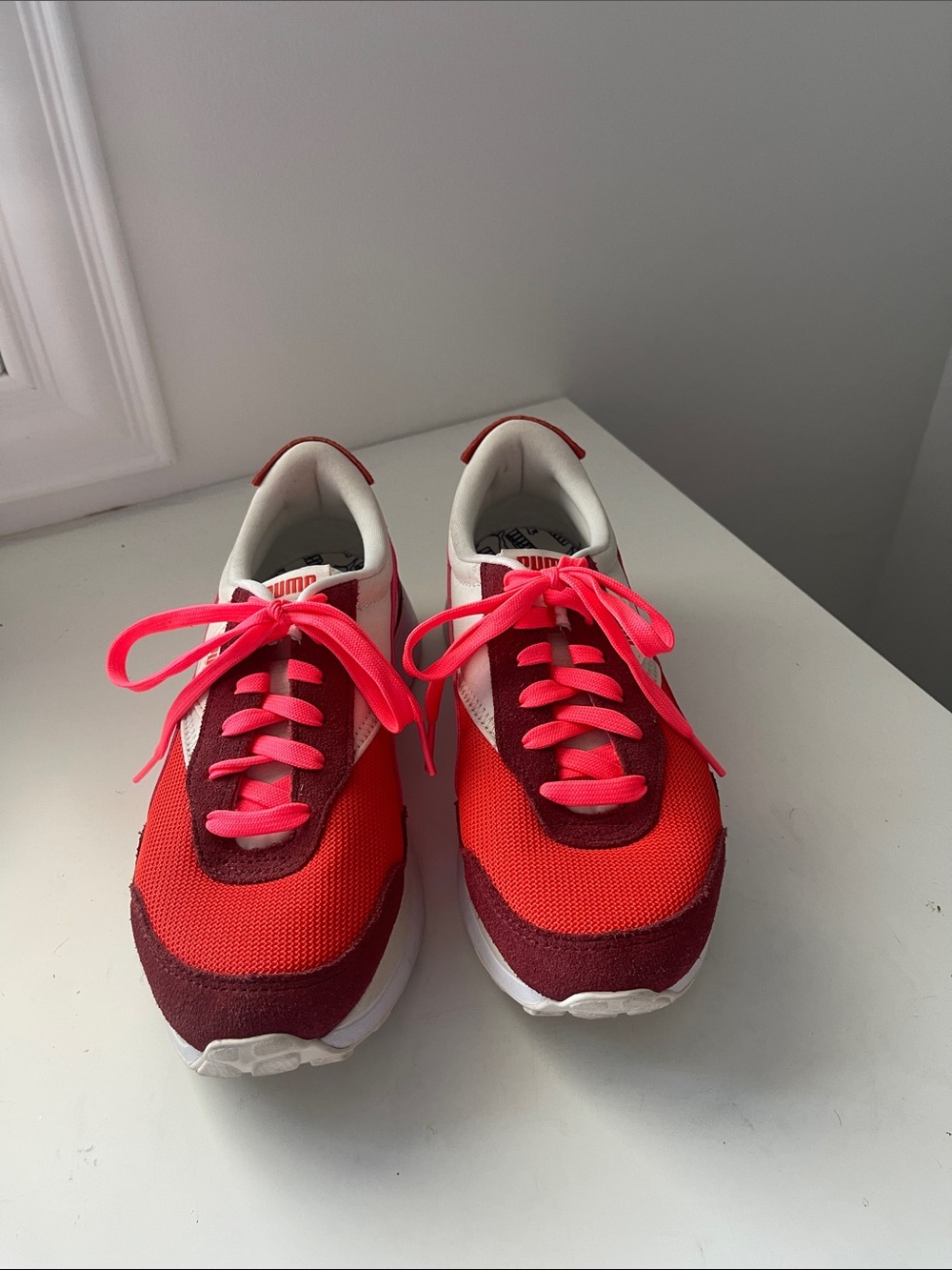Puma Maroon, tomato red, & hot pinkish-orange accents. Pink Retro Runner Sneaker